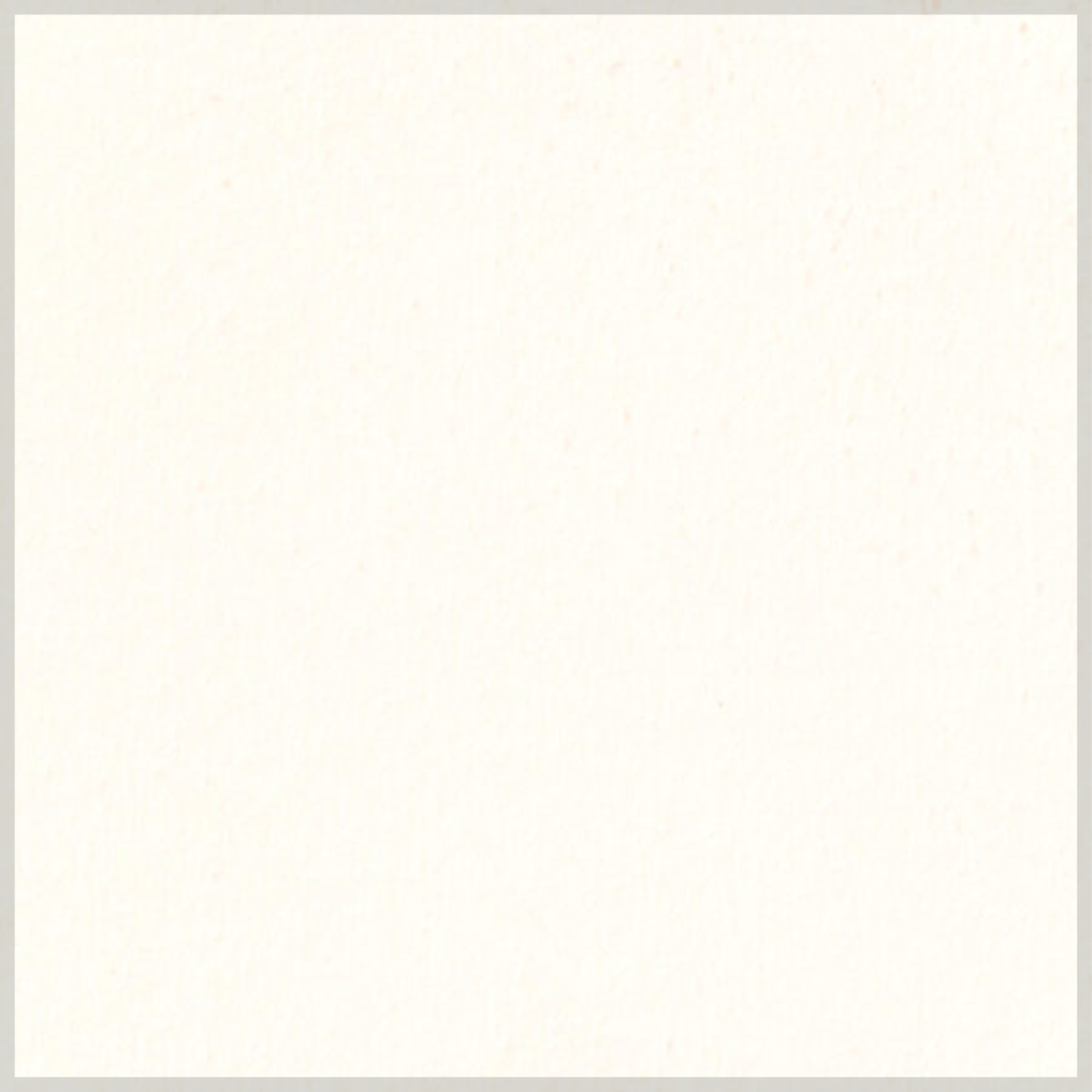 A blank off-white or cream-colored sheet of paper with a subtle texture and faint specks.
