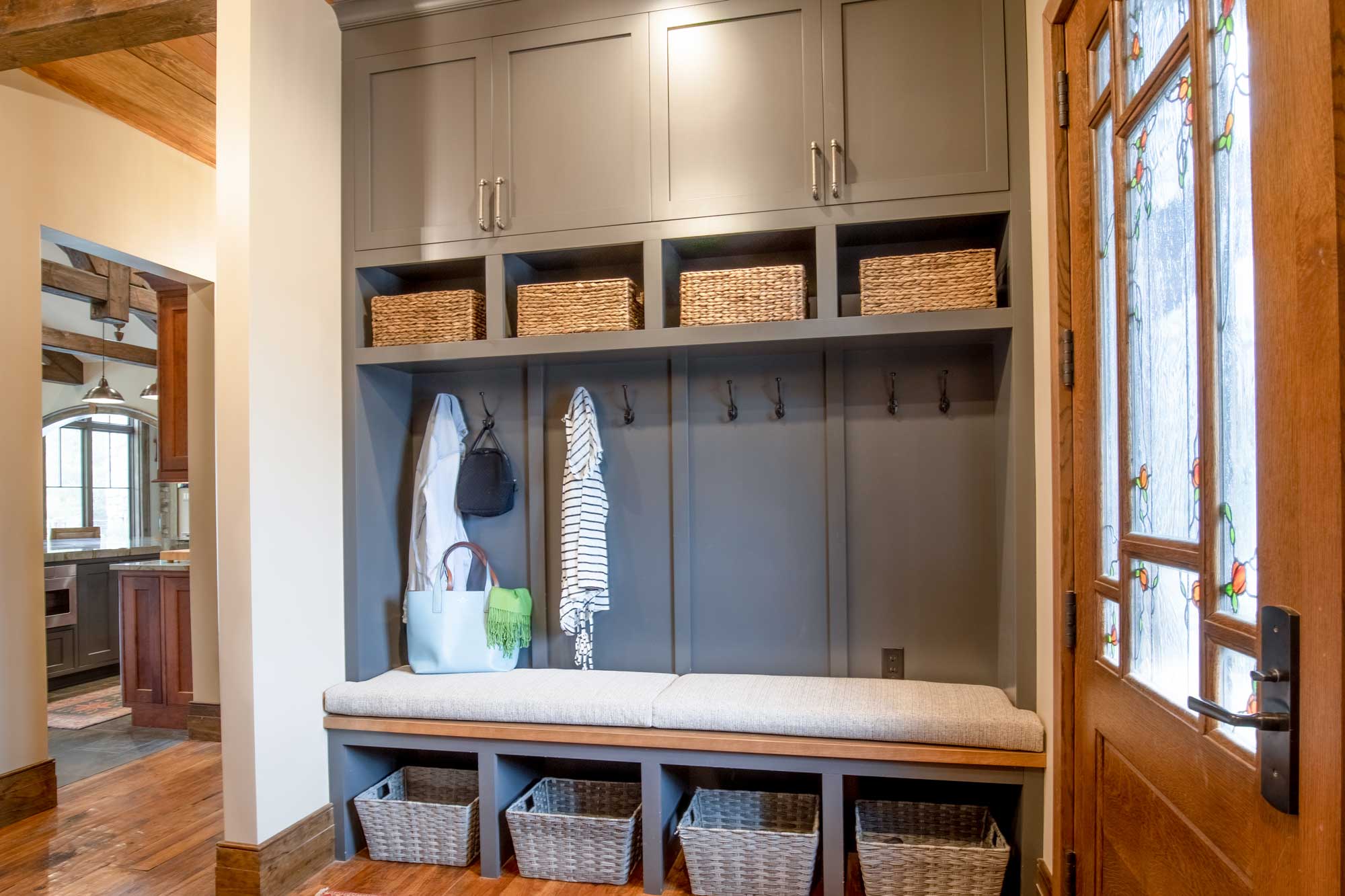 Mudroom storage with coat rack, bench, cabinets