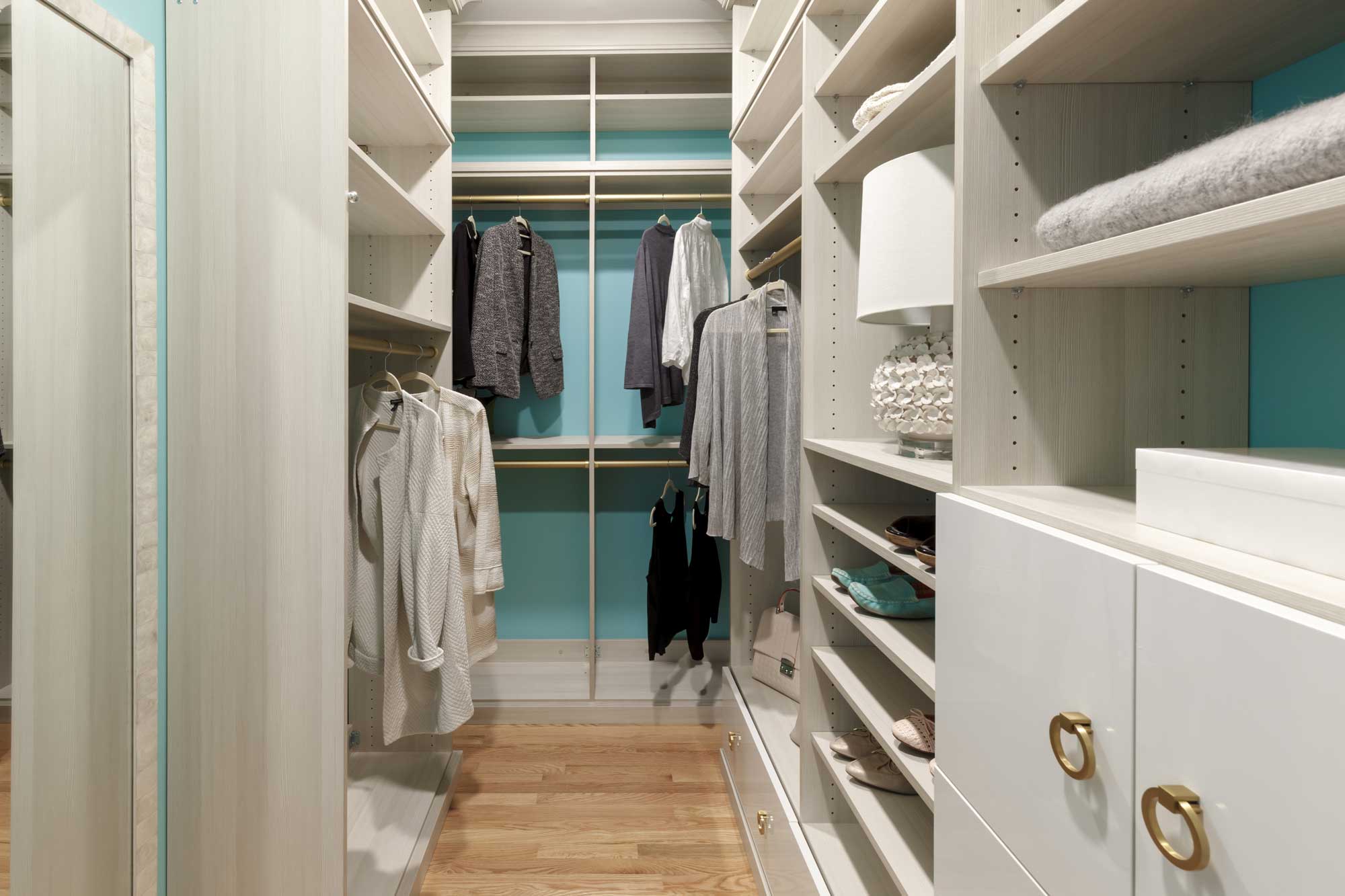 Walk-in closet with white shelving